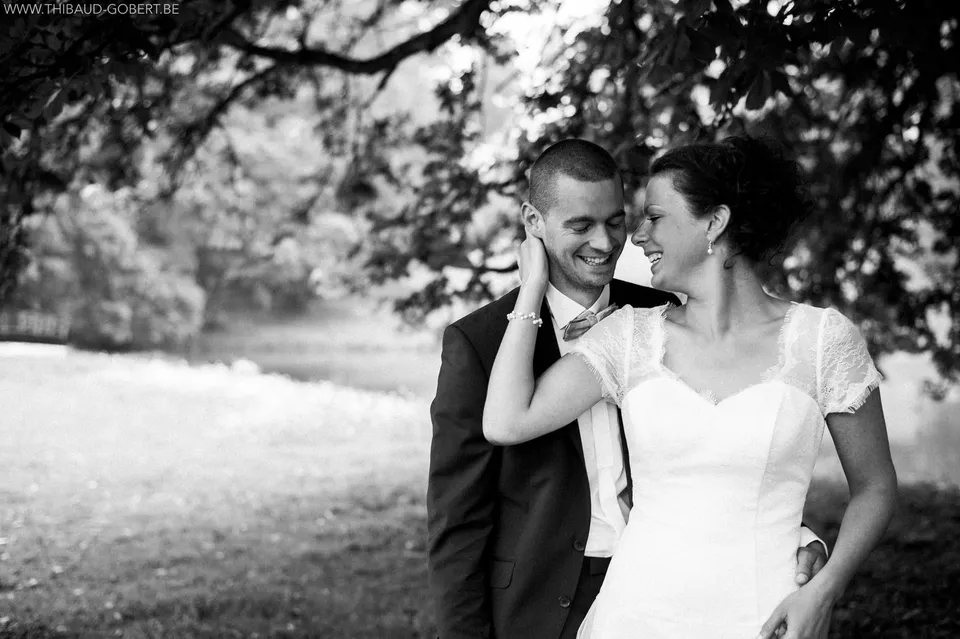 Bride and groom in front of a castle